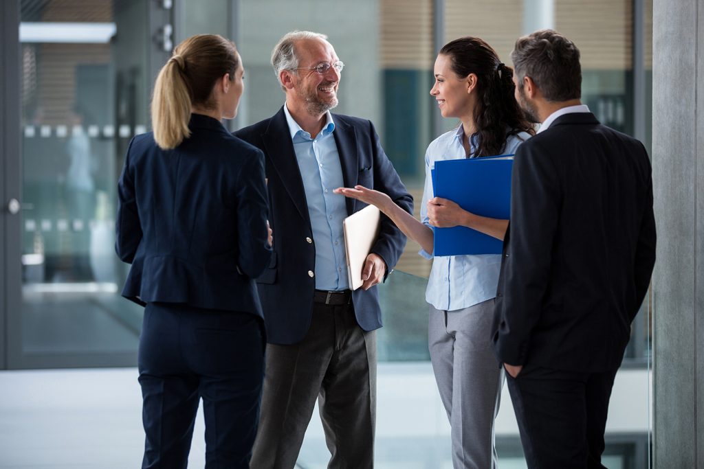 happy-businesspeople-having-a-conversatio-B2B